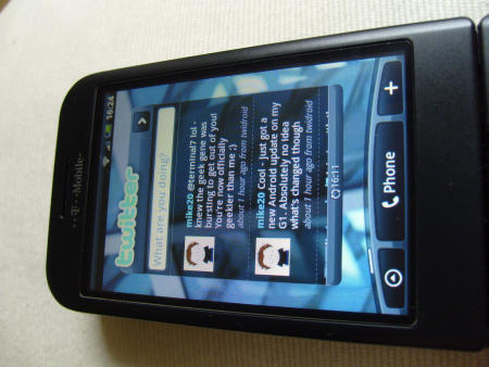 T-Mobile G1 with HTC Hero interface showing Twitter